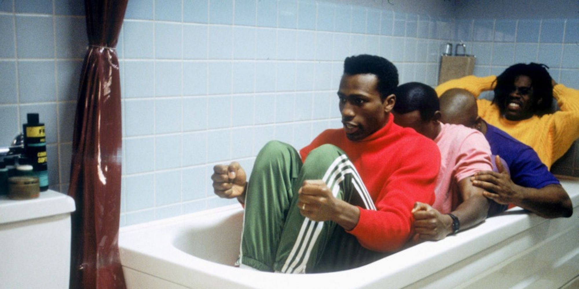 The team from Cool Runnings practicing in a bathtub together.
