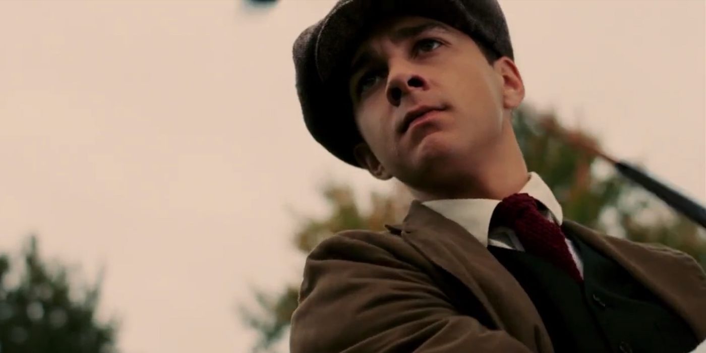 Shia LaBeouf as Francis Ouimet golfing and looking at the golf ball with expectations in The Greatest Game Ever Played