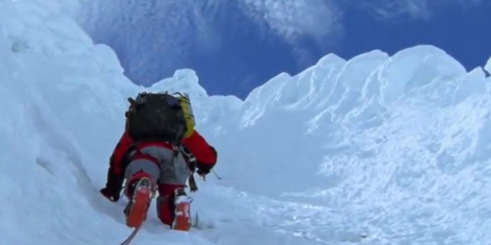 A climber climbing up a mountain in Touching the Void