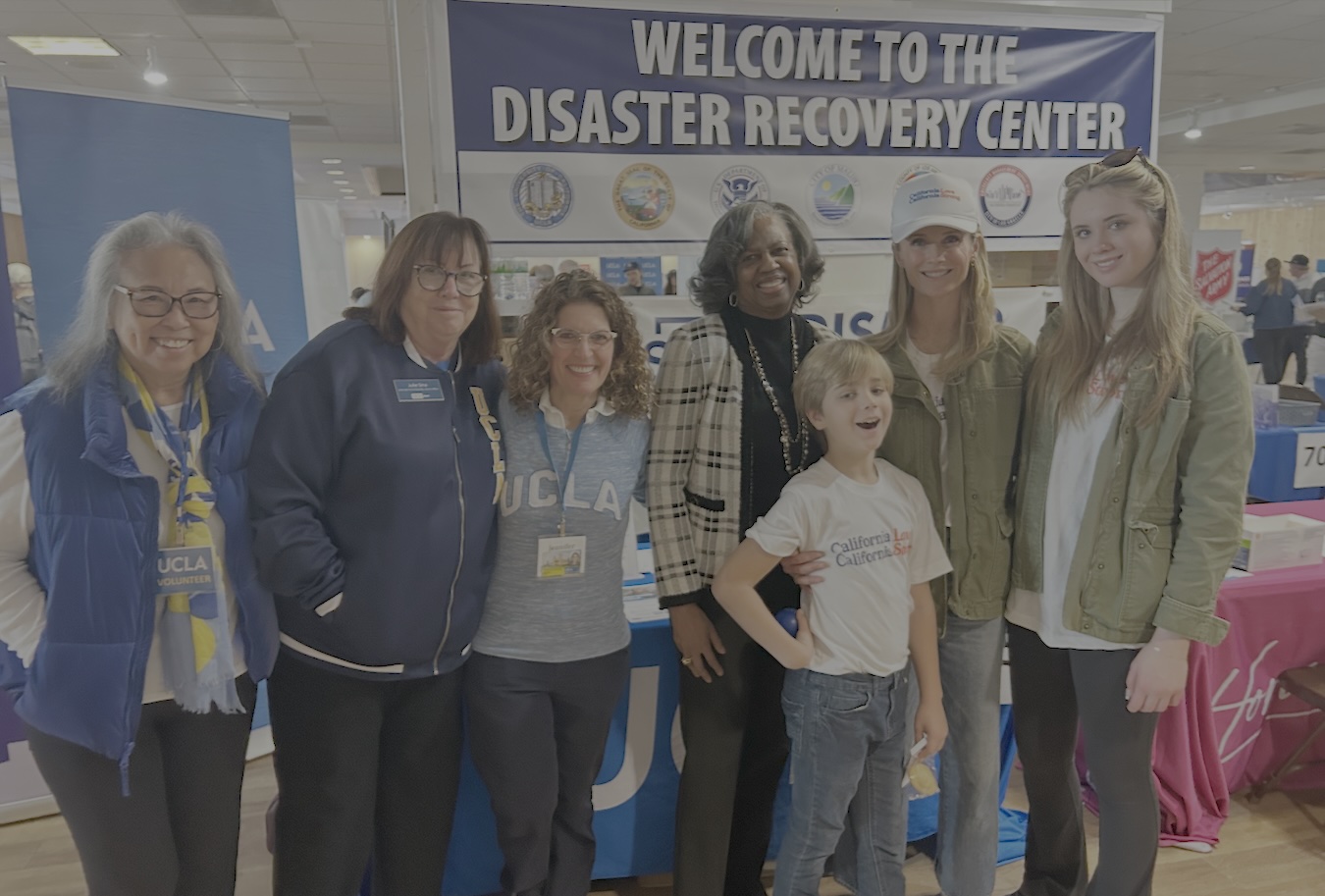 At the disaster recovery center (left to right): UCLA alumna volunteer Sally Lew; Julie Sina, UCLA associate vice chancellor for alumni affairs; Jennifer Poulakidas, UCLA associate vice chancellor for government and community relations; Yolanda Gorman, senior advisor to the UCLA chancellor and chief of staff; and California’s first partner Jennifer Siebel Newsom (with hat) and her children. At the disaster recovery center (left to right): UCLA alumna volunteer Sally Lew; Julie Sina, UCLA associate vice chancellor for alumni affairs; Jennifer Poulakidas, UCLA associate vice chancellor for government and community relations; Yolanda Gorman, senior advisor to the UCLA chancellor and chief of staff; and California’s first partner Jennifer Siebel Newsom (with hat) and her children.