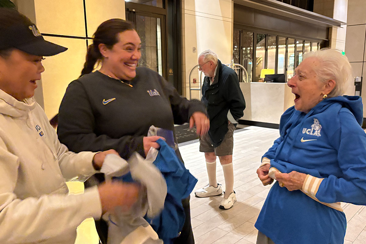 The UCLA softball team visits the Luskin Conference Center to help out those evacuated due to the fires